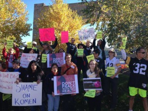 Activists rally against the pinkwashing partnership between Susan G. Komen and Baker Hughes. 