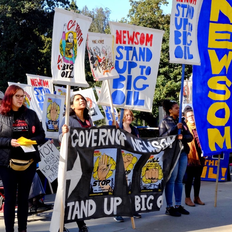 BCAction at a rally holding signs that read "Governor Newsom Stand Up to Big Oil."